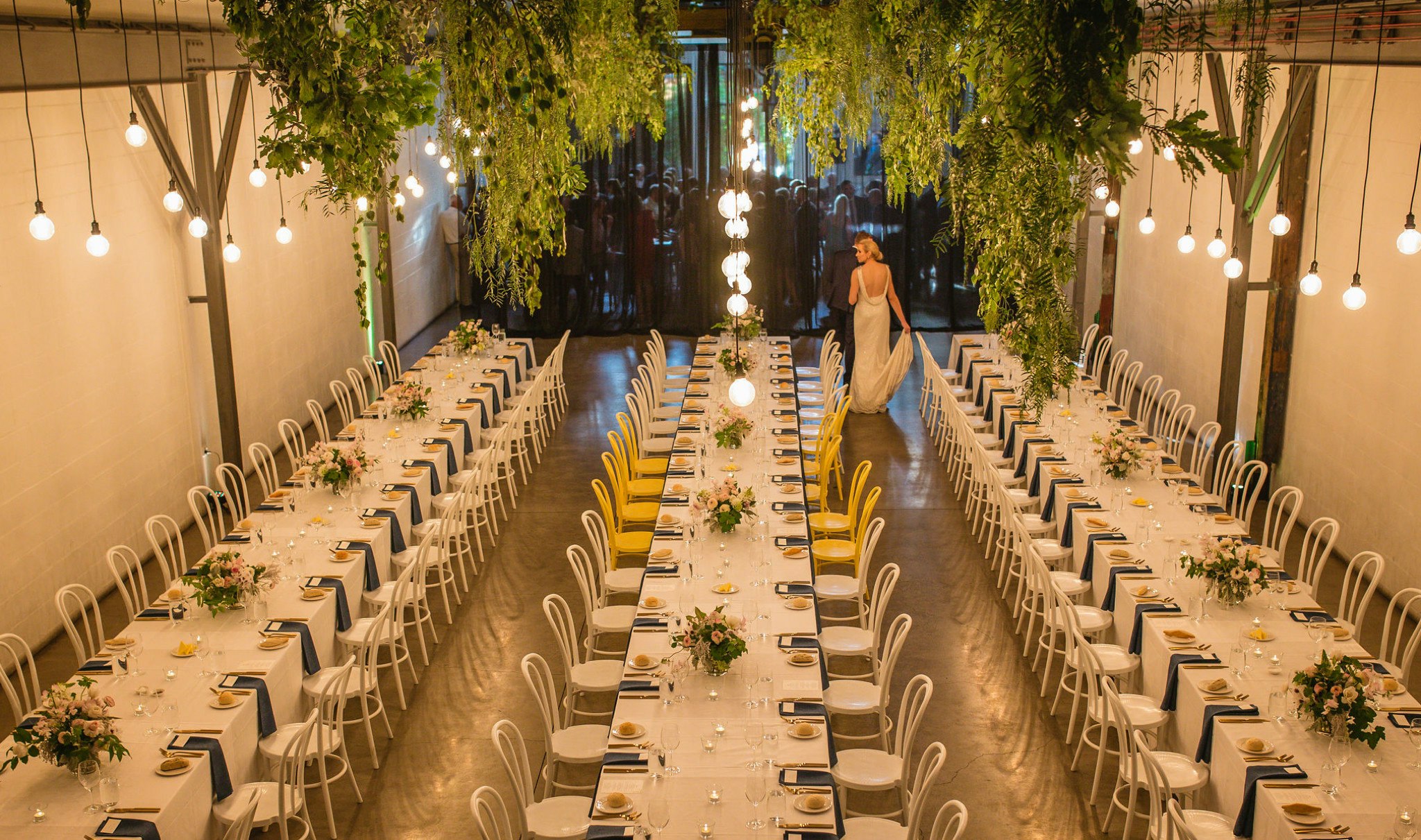Overlooking tables styled for a wedding reception.